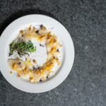 A white plate topped with sea food.