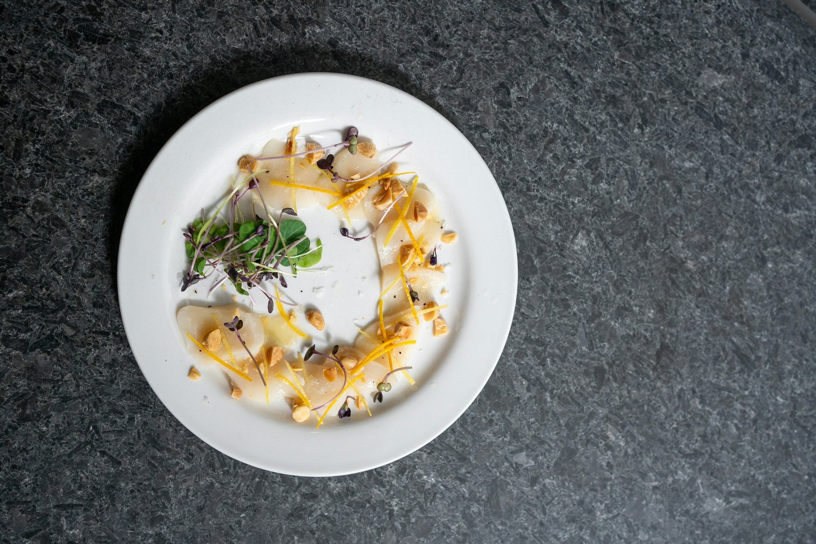 A white plate topped with sea food.